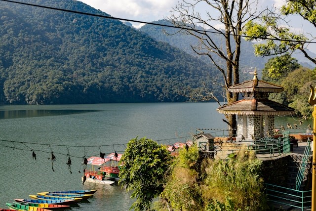 lake-near-the-house-and-temple-and-around-by-mountains